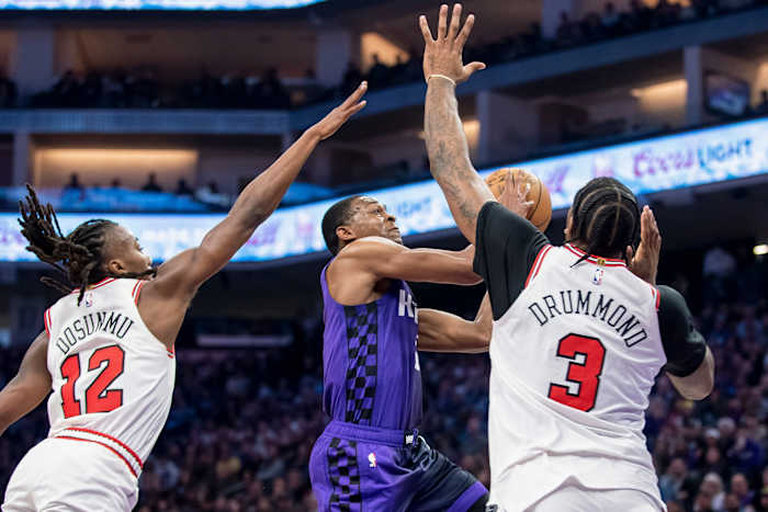 Sacramento Kings guard De'Aaron Fox (5) puts up a shot over Chicago Bulls center Andre Drummond (3) during the second quarter at Golden 1 Center.